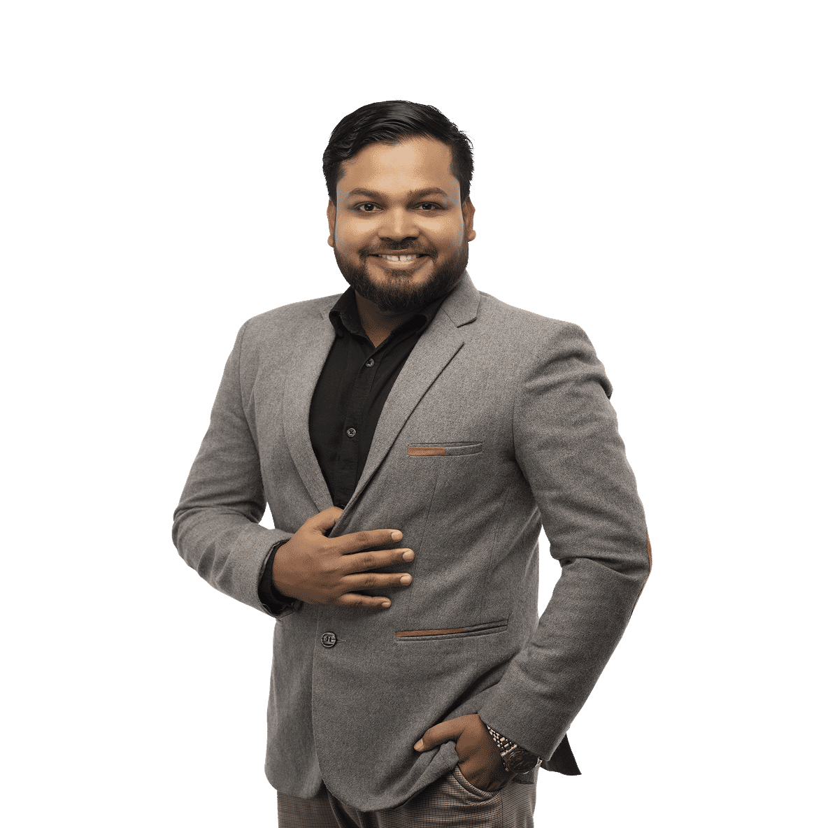 Smiling executive of quality control in gray blazer with tan accents and black shirt, hand on chest, edited